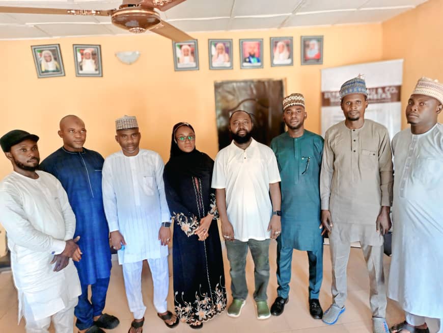 Group of Nigerian officials and community leaders discussing security issues in Niger North.