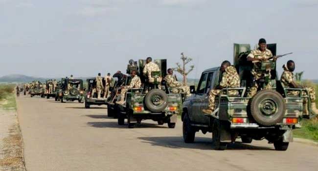 Nigerian military patrol convoy on the move in rural area.